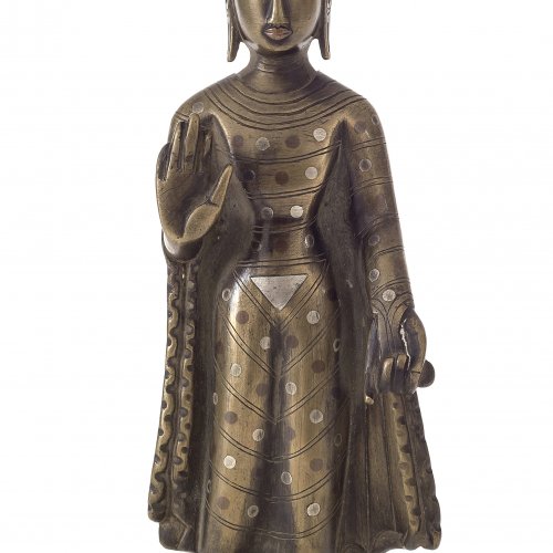 Buddha, stehend. Bronze, mit Silbereinlagen. H. 13 cm. Tibet