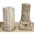 Zwei Säulenfragmente. Stein, bzw. Steinguss. Eine kanneliert, die andere mit figürlicher Basis im romanischen Stil. Besch. H. 50-59 cm.