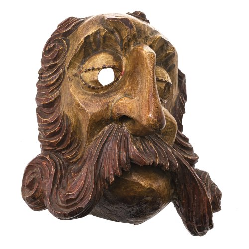 Maske. Tirol. Männerkopf mit markanter Barttracht und Nase. Holz, geschnitzt, Farbfassung. L. 27,5 cm.