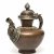 Teekanne. Tibet, 19./20. Jh. Kupfer getrieben mit Messingapplikationen. H. 25 cm. Gebrauchsspuren.