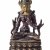 „Weiße Tara“ Tibet, 17./18. Jh. Schwere kupfrige Bronze. Kaltvergoldung mit blauem Pigment. Sehr fein bearbeitet und patiniert. H. 11 cm.