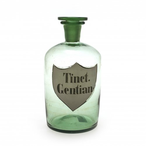 Apothekerflasche. Glas, für Tinctura Gentianae (Enziantinktur), hellgrünes Glas, H. 23,5 cm.