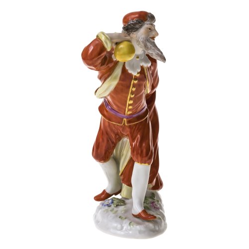 Meissen,  Porzellan, farbig staffiert. Pantalone aus der Commedia dell'arte. Sockel mit buntem Blütenbelag. Schwertermarke. H. 13,5 cm.