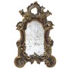 Spiegelkartusche. Holz, geschnitzt, übergangene Farb- und Goldfassung. Best. 40 x 26 cm.