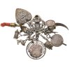 Gürtelhaken mit zwölf Anhängern. Silber, u.a. Patrona-Bavaria-Medaille, Neidfeige, Krickerl. L. Haken 4,5 cm.