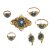Brosche, zwei Paar Ohrringe, zwei Ringe. Schaumgold, türkisfarbener Perlbesatz. Ring rep.