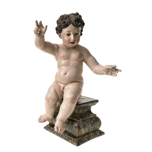 Jesusknabe mit Weintraube. Italien, 18./19. Jh. Holz, übergangene Fassung. H. 48 cm, Sockel 17 cm.
