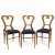 Drei Stühle. Schaufellehne. Nussbaum furniert. H. ca. 94 cm, Sitzhöhe 50 cm.