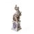 Putti auf einem Weinfass mit Traube. Porzellan, farbig staffiert. Gemarkt. Nymphenburg. H. 17,3 cm.