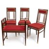 Kleine Sitzgruppe. Um 1905. Entwurf wohl Hans Christiansen, Ausführung Ludwig Schäfer. Drei Stühle und ein Tabouret. Buche, Palisander furniert. Messingbeschläge und Messingfüße. H. 90 cm, Sitzhöhe 46 cm bzw. H. 68,5 cm, Sitzhöhe 44 cm. Rest.