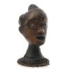 Tanzaufsatz in Form eines Mädchenkopfes. Nigeria. Holz, Lederbezug, bemalt. Leicht besch. H. 25 cm.