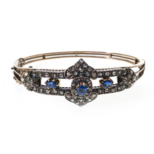 Armreif. Gold, mit Diamant- und Saphirbesatz (möglicherweise synthetisch, erg.).