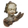 Engelskopf. Holz, übergangene Farbfassung. Besch., rest. H. 16 cm.