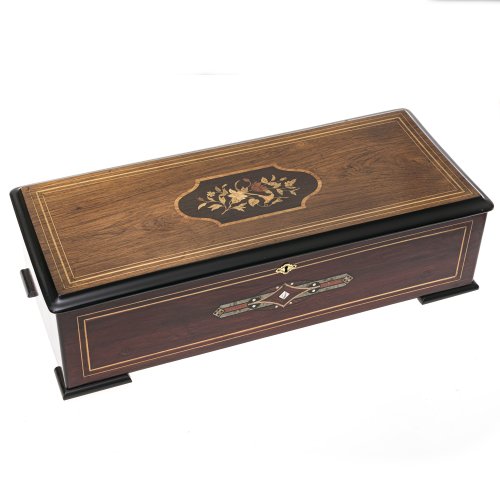 Musikspieldose. Hersteller Gueissaz, Schweiz, ca. 1860-70. Sublime Harmonie Soprano. Holz, teilw. intarsiert. Trägt die Nr. 20753. 17,5 x 65 x 27,5 cm. Acht Musikstücke spielbar. Rest., best. am Deckel. In der Schweiz vor ca. 15 Jahren fachmännisch überholt. Mit Schlüssel.