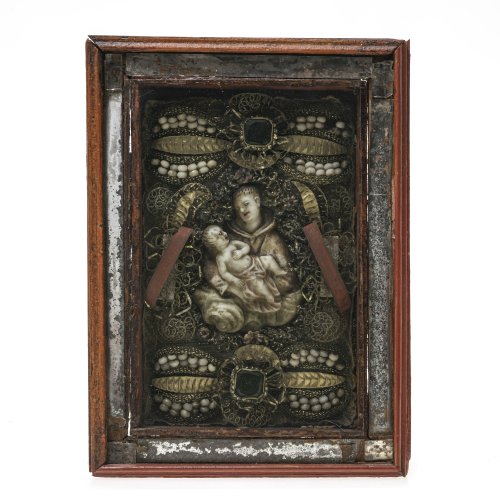 Klosterarbeit. Bayern, 19. Jh. Darstellung des Heiligen Antonius von Padua in Wachs. Reliquien des Heiligen Antonius und Innozenz. 16,5 x 11 cm. Alterungsspuren.