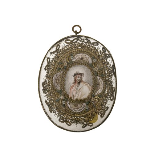 Alpenländisch, um 1800. Ovale Reliquienkapsel, zentrales Medaillon mit Gouachemalerei, avers Jesus mit Dornenkrone, revers Gekreuzigter. 10 x 8 cm. Minim. Alterungsspuren.