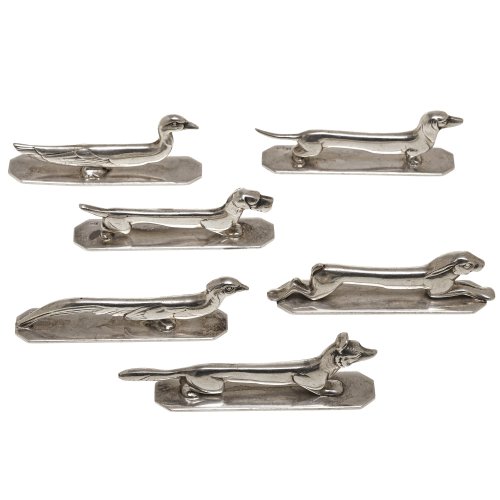 Sechs Messerbänke, Metall, versilbert. Verschiedene jagdbezogene Motive. L. ca. 9,5-11 cm. Guter Erhaltungszustand.