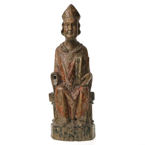 Hl. Bischof. Holz, Reste von Farbfassung. Besch., eine Hand fehlt. H. 60 cm.