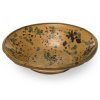 Tiefe Schüssel. Irdenware, ockerfarben glasiert, Spritzdekor in Braun und Grün. Rand unterseitig mehrfach best. ø 42 cm.