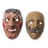 Zwei Perchtenmasken. Holz, geschnitzt, farbig bemalt. Männerköpfe, einer mit Bart. Alterungsspuren. H. 22-24 cm.