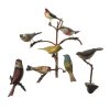 Acht Vögel. Alpenländisch, 19. Jh. Unterschiedliche Vogelarten. Zwei einzelne Vögel auf einem Ast sitzend, sechs weitere Vögel auf einem neuzeitlichen Ast befestigt. Holz, naturalistisch bemalt. Diverse Größen. Alterungsspuren, minim. besch.