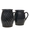 Zwei Krüge. Irdenware, dunkelblau glasiert, einer schräg gerippt. Best. H. 21-22 cm.