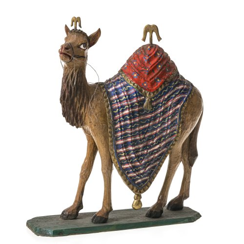 Krippendromedar. Holz, farbig gefasst. H. 32 cm.