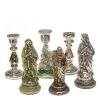 Kovolut Bauernsilber, sechsteilig: drei Wallfahrtsfiguren und drei Kerzenleuchter. Glas, versilbert. Alterungsspuren. H. 16-19 cm.