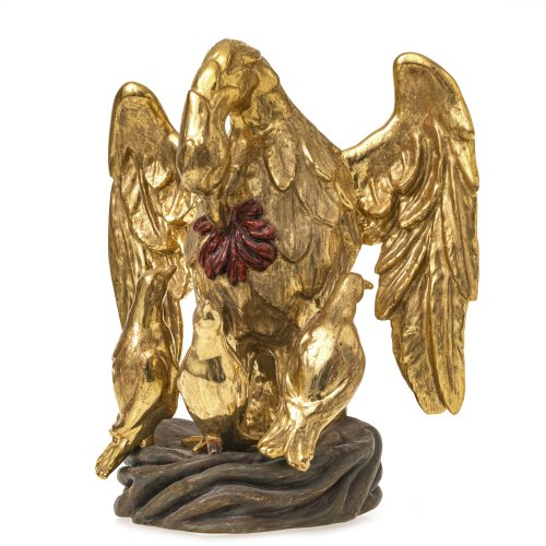 Deutsch, 18./19. Jh. Pelikan nährt seine Jungen. Holz, erneuerte Vergoldung. H. 31 cm.