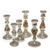 Sechs Kerzenleuchter. Bauernsilber. H. 16-22 cm.