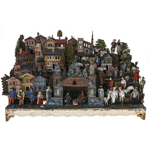 Krippe. Erzgebirge/Böhmen. Holz, geschnitzt, farbig bemalt. Leicht besch., ohne Gehäuse. 46 x 75 x 31 cm.