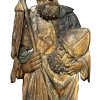 Süddeutsch, 17./18. Jh. Hl. Dionysius. Relief. Holz, ungefasst. Rep., besch. H. 62,5 cm.