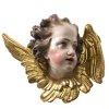 Süddeutsch. Puttenkopf mit Flügeln. Gipsguss, übergangene Farb- und Goldfassung, rücks. gehöhlt. Ca. 30 x 35 cm.