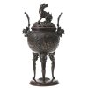 China. Räuchergefäß aus Bronze. Kugelförmiges Gefäß mit zwei gleichen Szenen im Medaillon, dargestellt sind u.a. ein Priester und Begleiter mit Windfächer und Fahne. H. ca. 31 cm, B. ca. 17 cm.  Alterungsspuren.