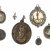 Sieben Wallfahrtsandenken. Bronze, Zinn, versilbert.
