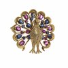 Brosche. Pfauenform. Saphir-, Brillian-, Rubinbesatz. 18 K. GG.