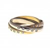 Freundschaftsring. Drei ineinander verschlungene Ringe mit Diamantbesatz.