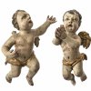 Zwei Putti. Süddeutsch, 18./19. Jh. Übergangene Farbfassung. Erg., besch. H., je ca. 29 cm.
