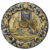 Teller. Holz, farbig bemalt. 18/19. Jh.,  in der Art von Urbino. Urteil des Salomon. ø49,5 cm. Rep., besch.