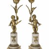 Leuchterpaar. Deutsch, Ende 18. jh. Sitzende Putti mit Blume. Alabastersockel. Feuervergoldet. H., je ca. 30,5 cm.