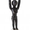 Steinschleuder. Guro/Elfenbeinküste. Holz. In Gestalt einer weiblichen Figur mit erhobenen Armen. H. 22,5 cm.