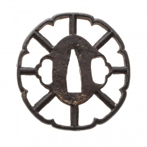 Tsuba. Japan, Edo/Meiji. Eisen. In Form eines Wagenrades. ø 7 cm.