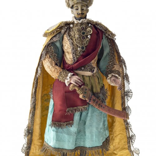 Krippenfigur. Stehender Osmane. Kopf Wachs, Hände Holz. H. 44 cm.