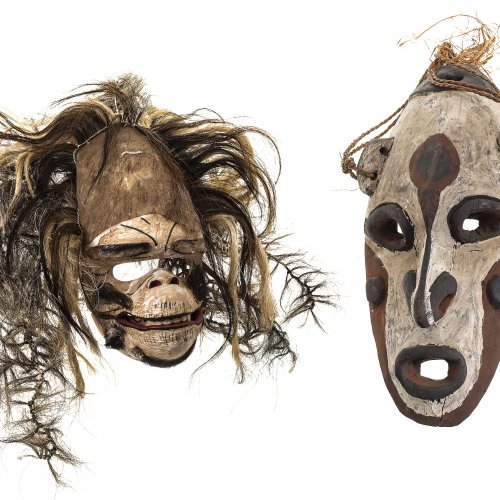 Zwei Masken. Afrika. Holz, eine mit Tierhaar.