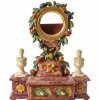 Taschenuhrenständer. Süddeutsch. Holz, geschnitzt, farbig gefasst und marmoriert, mit Früchten, Blättern und Schublade. Rest. H. 21,5 cm.