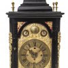 Stockuhr, Holzgehäuse, geschwärzt, Messingbeschläge, Carl Dunst, München, Ende 18. Jh., H. 61 cm.